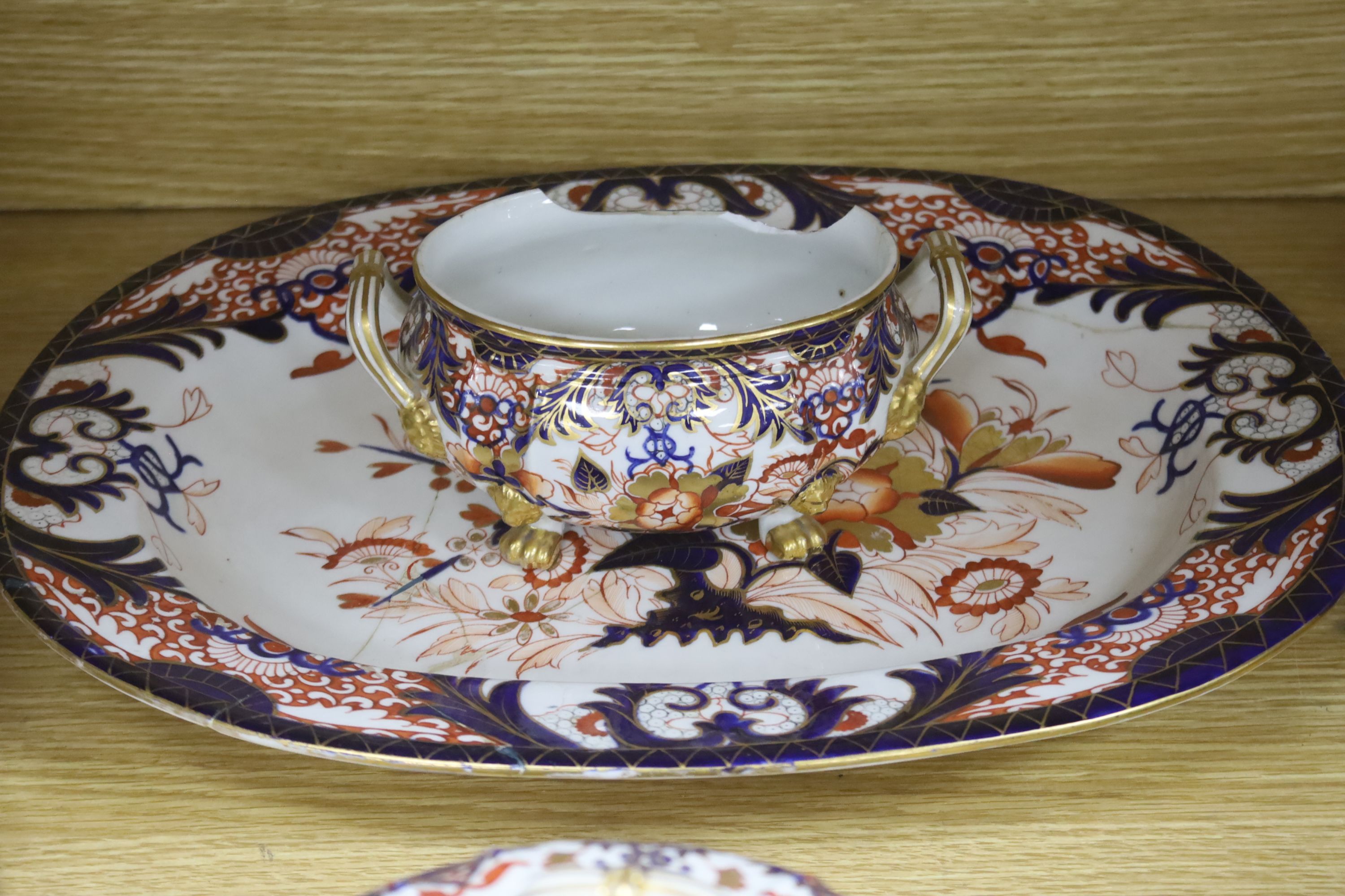 A collection of Royal Crown Derby Imari patterned ceramics including cups, side plates and platter